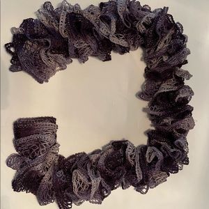 Different color purple looks to be hand made scarf